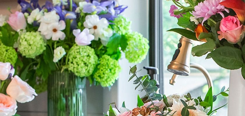 Vibrant floral arrangements featuring roses, daisies, and seasonal blooms in elegant vases.