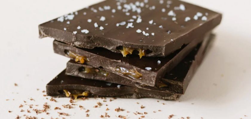 Delicious dark chocolate bars with a sprinkle of sea salt, showcasing layers of rich flavor.