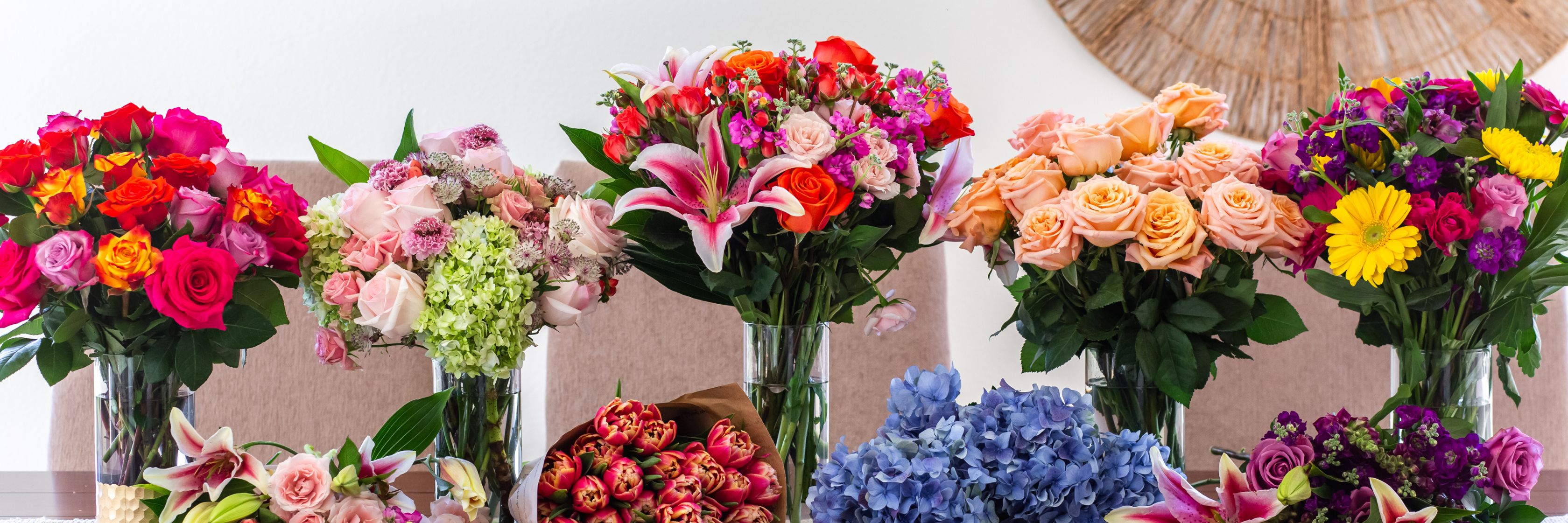 Vibrant floral display featuring diverse bouquets in vivid colors, ideal for celebrations and gifts.