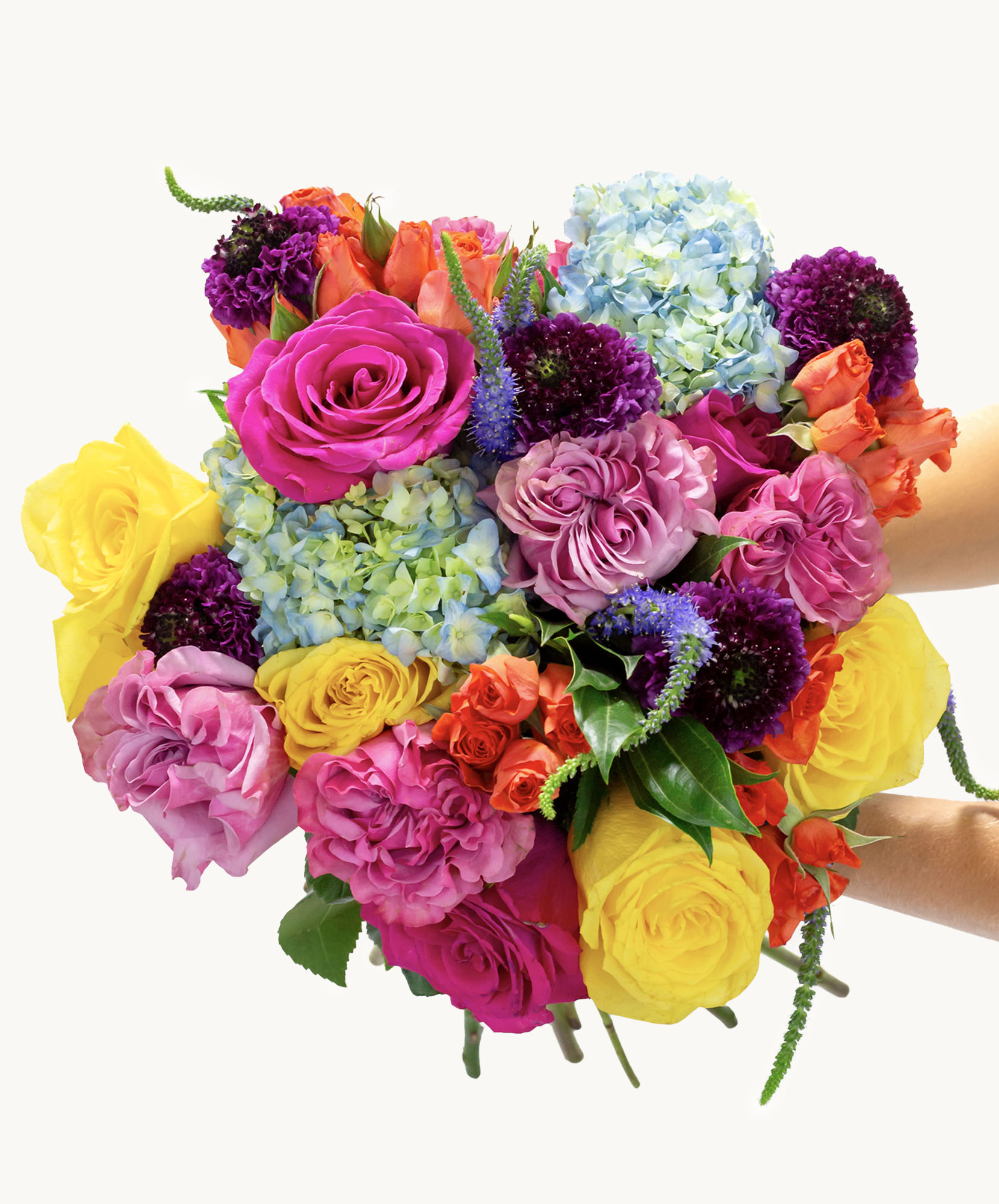 Vibrant floral bouquet featuring pink and yellow roses, hydrangeas, and colorful seasonal blooms.