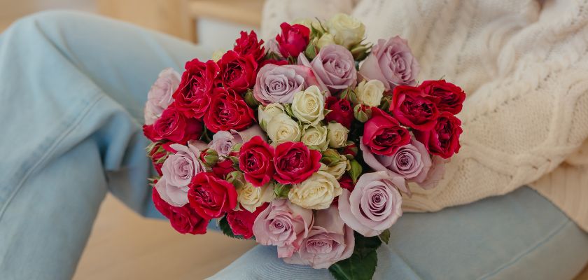 Vibrant bouquet featuring red, lavender, and white roses, perfect for celebrating special occasions.