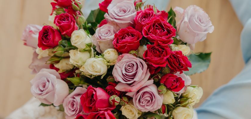 Vibrant bouquet of red and blush roses, elegantly arranged for any celebration or romantic occasion.