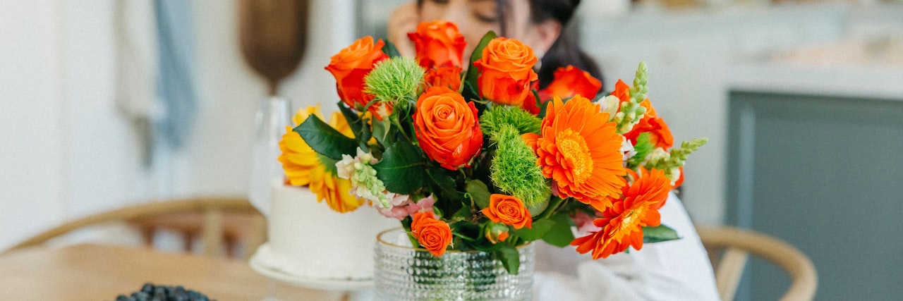 Vibrant orange roses and cheerful yellow gerberas in a stunning bouquet arrangement.