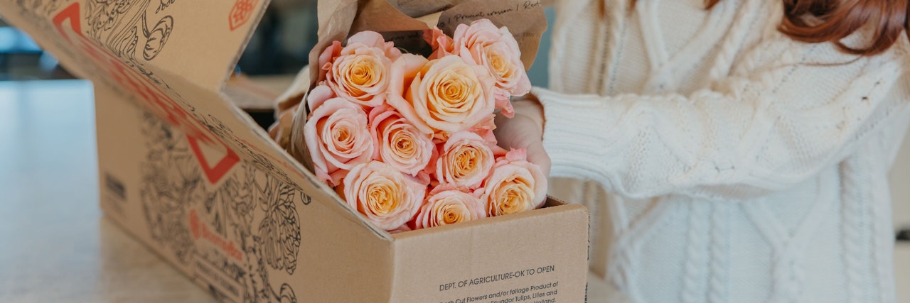 A beautiful box filled with soft pink roses, freshly delivered and ready to cherish.