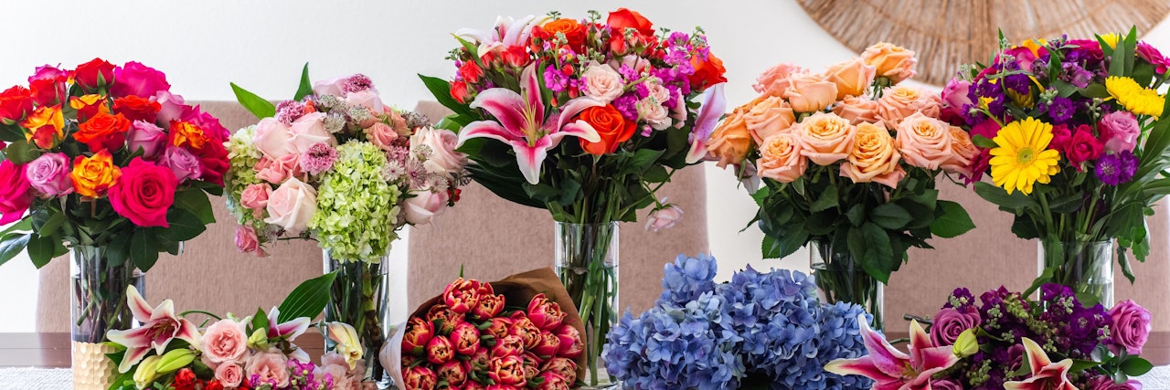 Vibrant floral arrangements featuring roses, lilies, and seasonal blooms in elegant vases.
