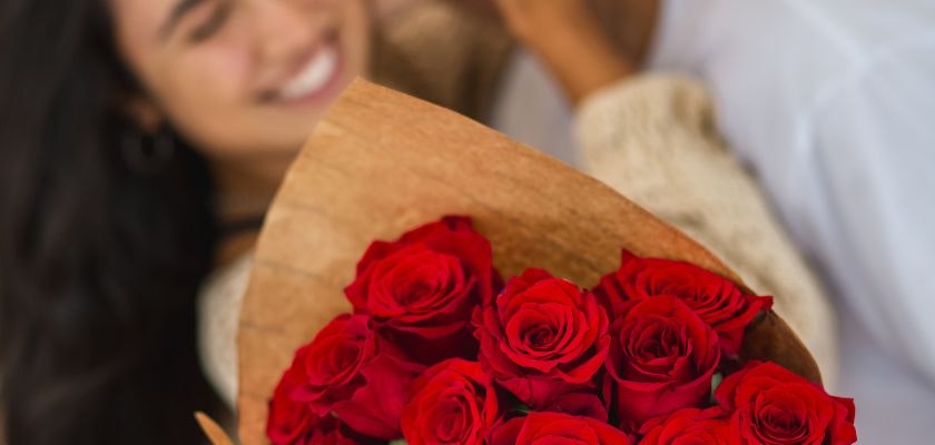 Vibrant red roses in a rustic bouquet, perfect for romantic gestures and celebrations.