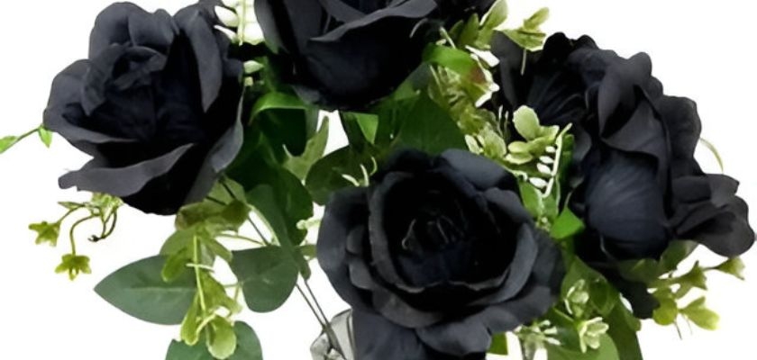 Elegant black rose arrangement with lush greenery, perfect for gothic decor or unique occasions.