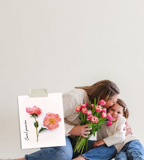 Woman and child sharing a sweet moment with pink flowers, showcasing love and joy.