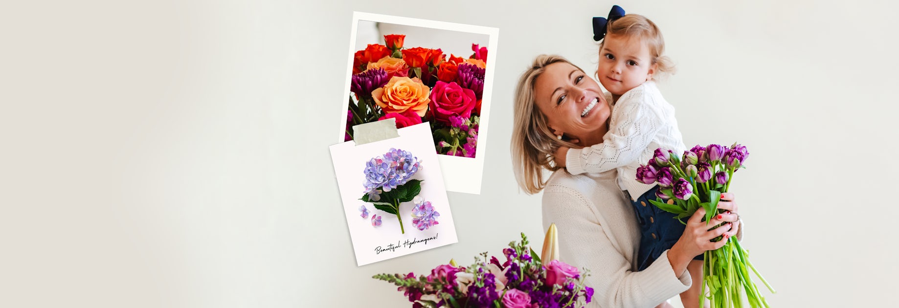 A joyful woman holds a vibrant bouquet with a child, surrounded by colorful flowers.