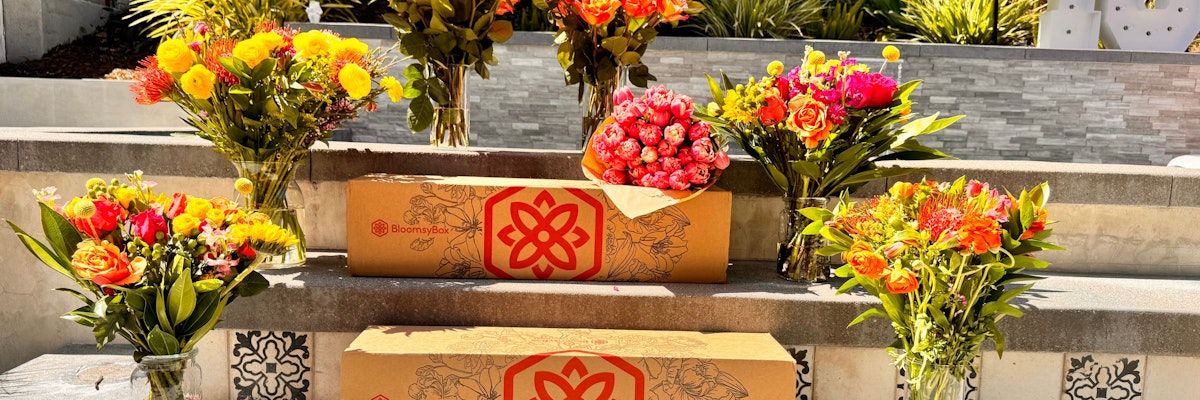 Colorful floral arrangements featuring vibrant blooms in decorative packaging, perfect for gifting.