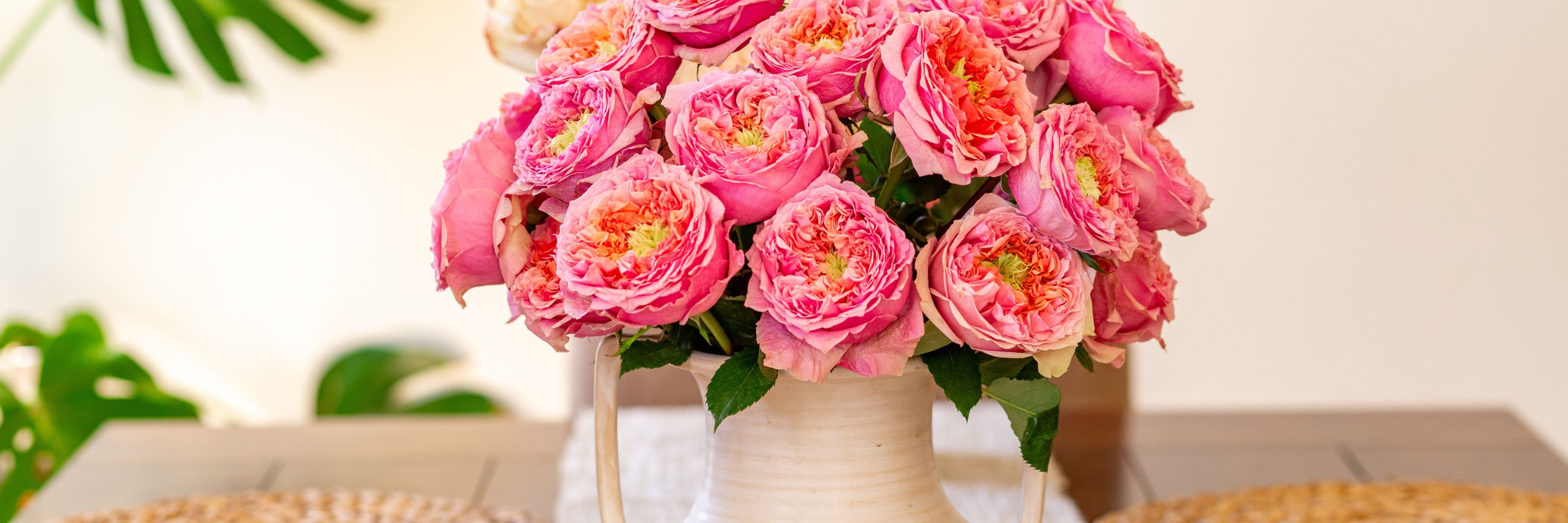 Beautiful bouquet of pink roses in a chic vase, perfect for home decor or gifts.