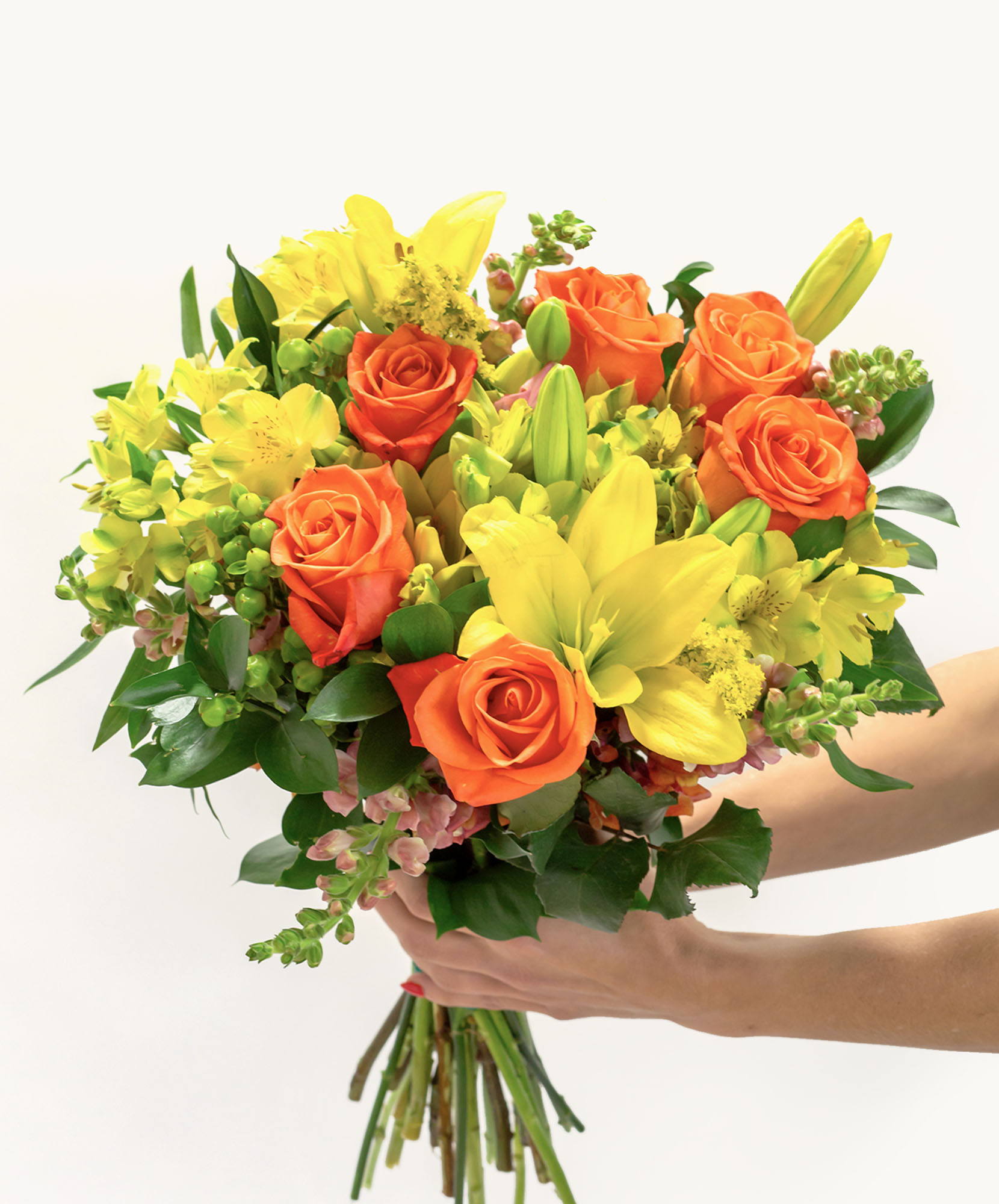 Vibrant bouquet featuring orange roses, yellow lilies, and lush greenery, perfect for celebrations.