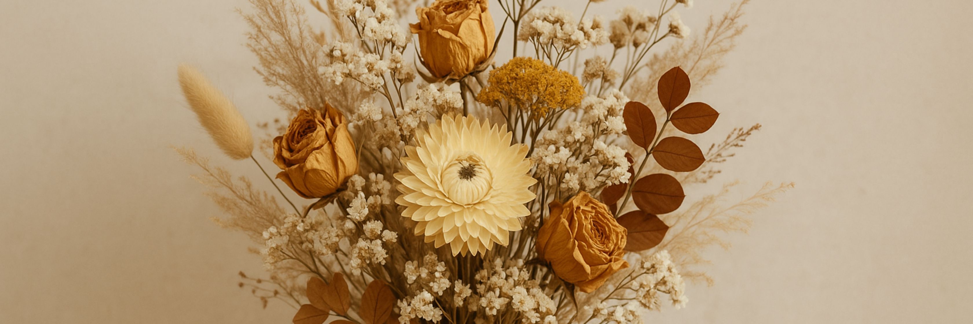Dried flower arrangement featuring yellow roses, vibrant blooms, and delicate foliage.