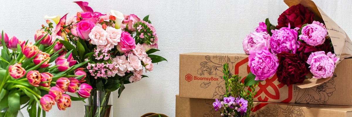 Colorful floral arrangements featuring roses, tulips, and peonies in stylish vases.