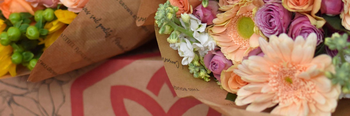 Vibrant floral bouquets featuring gerbera daisies, roses, and seasonal blooms, beautifully wrapped.