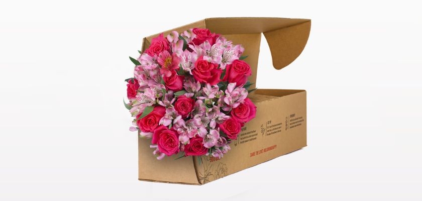 Vibrant pink rose and alstroemeria bouquet beautifully packaged for delivery.