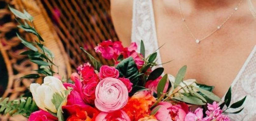 Vibrant floral bouquet featuring pink roses, tulips, and greenery for special occasions.