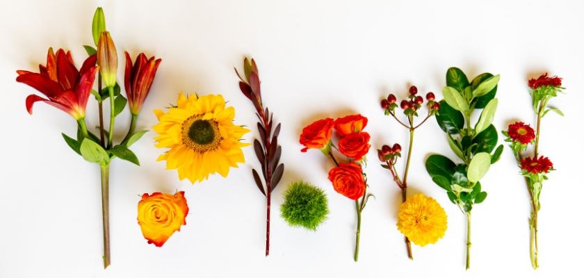 Vibrant floral selection featuring lilies, sunflowers, roses, and greenery, ideal for arrangements.