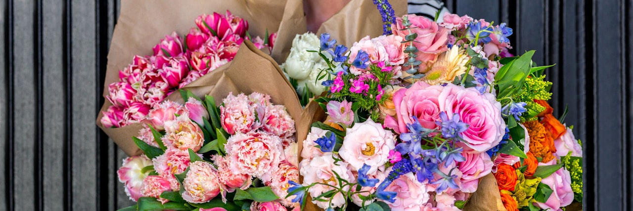 Vibrant bouquet collection featuring peonies, roses, and wildflowers, beautifully wrapped.