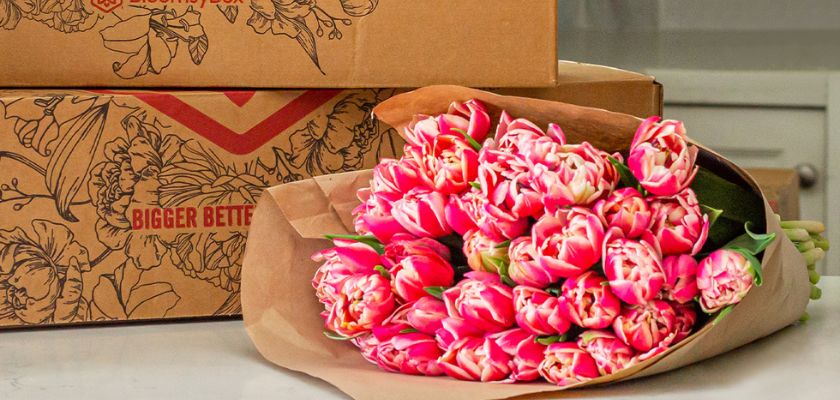 Vibrant bouquet of pink tulips elegantly wrapped, perfect for gifting or home decor.