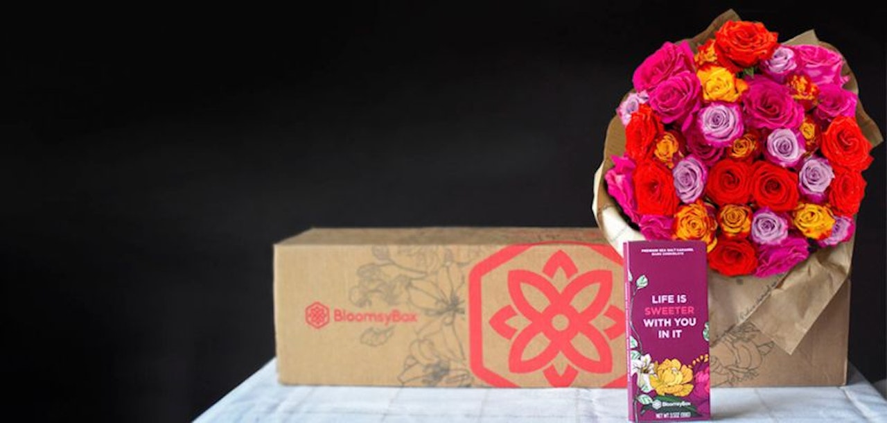 Vibrant floral bouquet with pink, purple, and orange roses, enhancing any celebration.