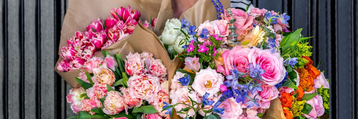 Vibrant bouquets featuring peonies, roses, and mixed colorful blooms in elegant wraps.