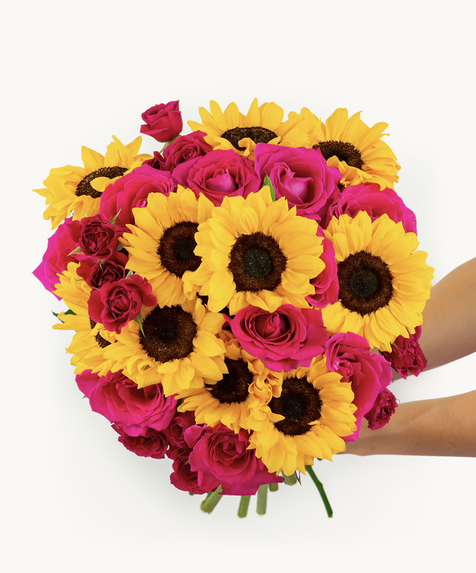 Vibrant bouquet featuring bright sunflowers and bold pink roses, ideal for celebrations.