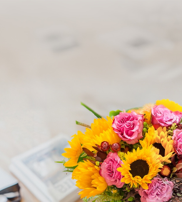 Vibrant bouquet featuring sunflowers and pink roses, perfect for celebrations and gifts.