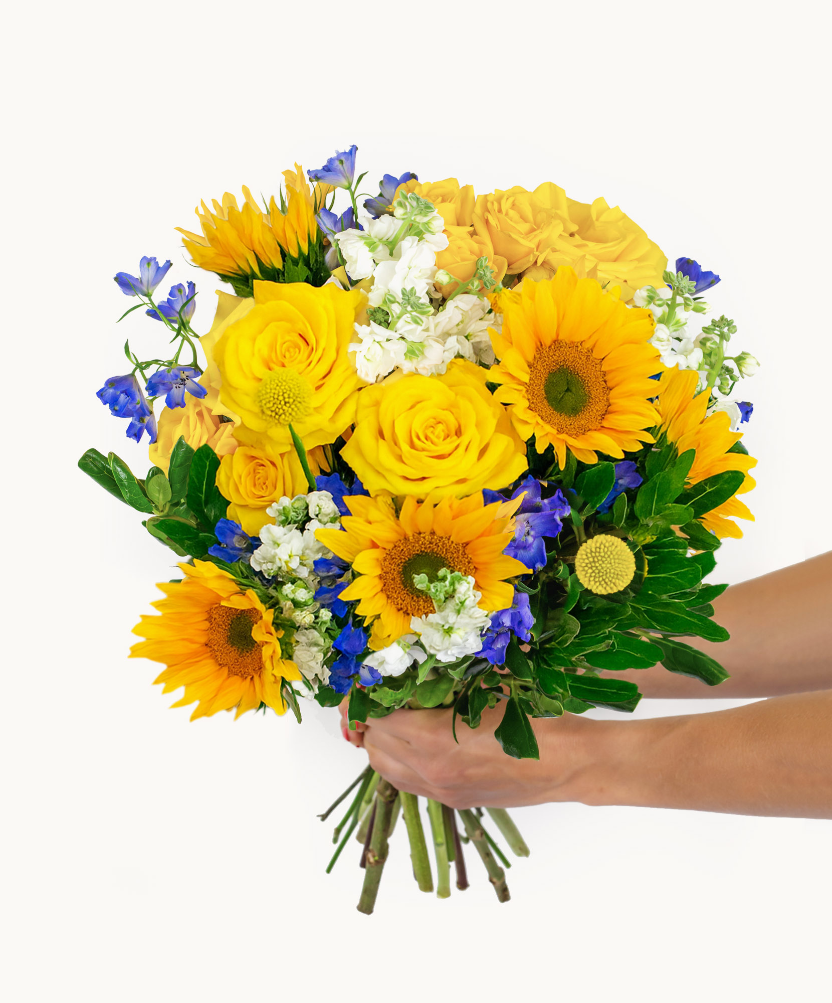 Bright and cheerful bouquet featuring sunflowers, yellow roses, and blue delphinium flowers.