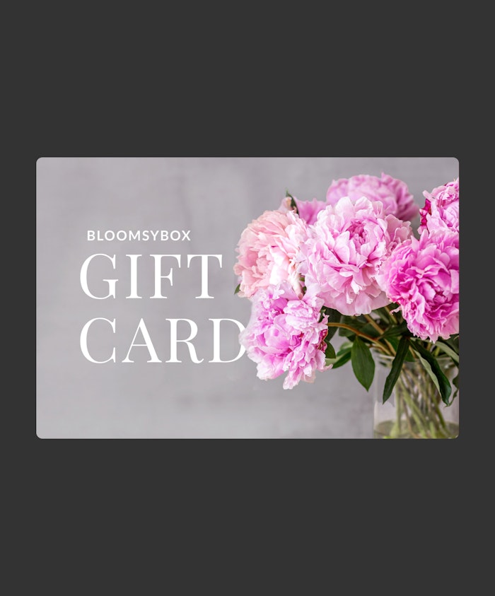 Elegant BloomsyBox gift card featuring lush pink peonies in a stylish arrangement.