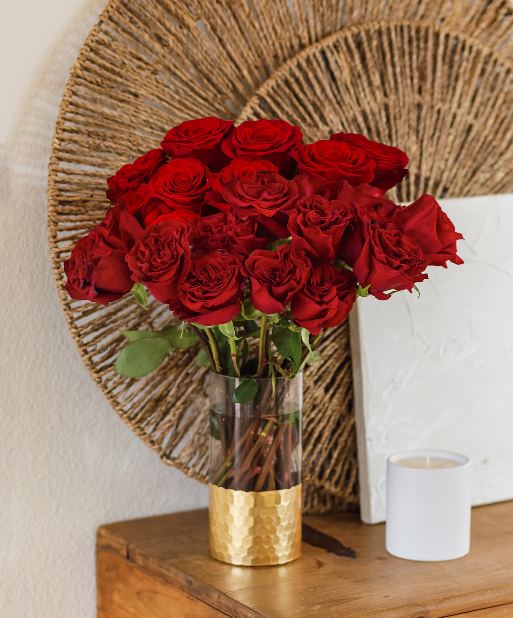 Vibrant red rose bouquet in a gold vase, perfect for home decor and special occasions.