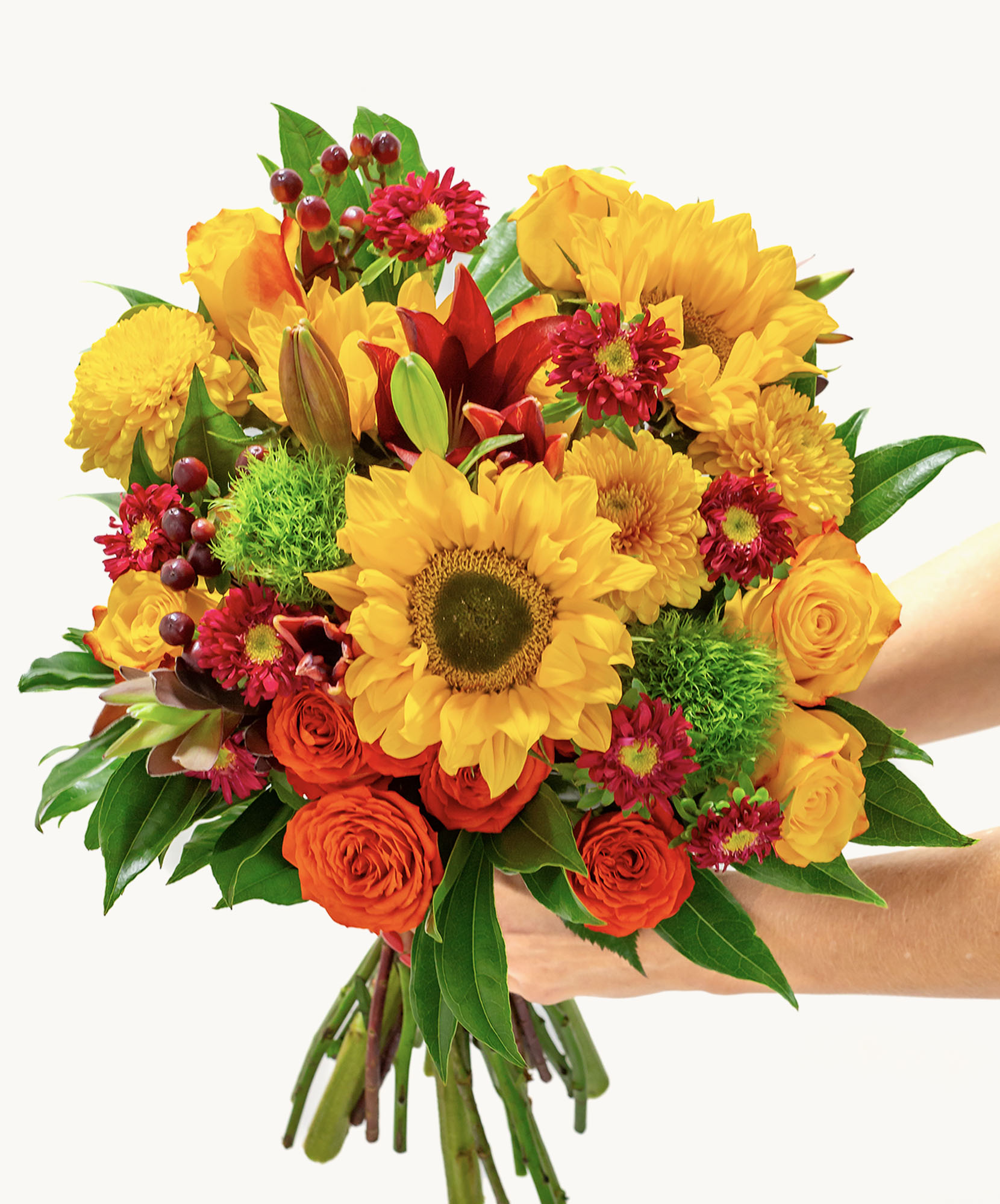 Vibrant bouquet of sunflowers, roses, and autumn blooms, perfect for cheerful occasions.