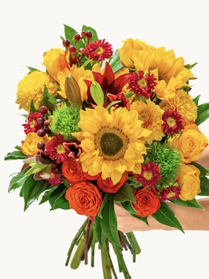 Vibrant bouquet of sunflowers, roses, and autumn blooms, perfect for cheerful occasions.