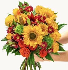 Vibrant bouquet of sunflowers, roses, and autumn blooms, perfect for cheerful occasions.