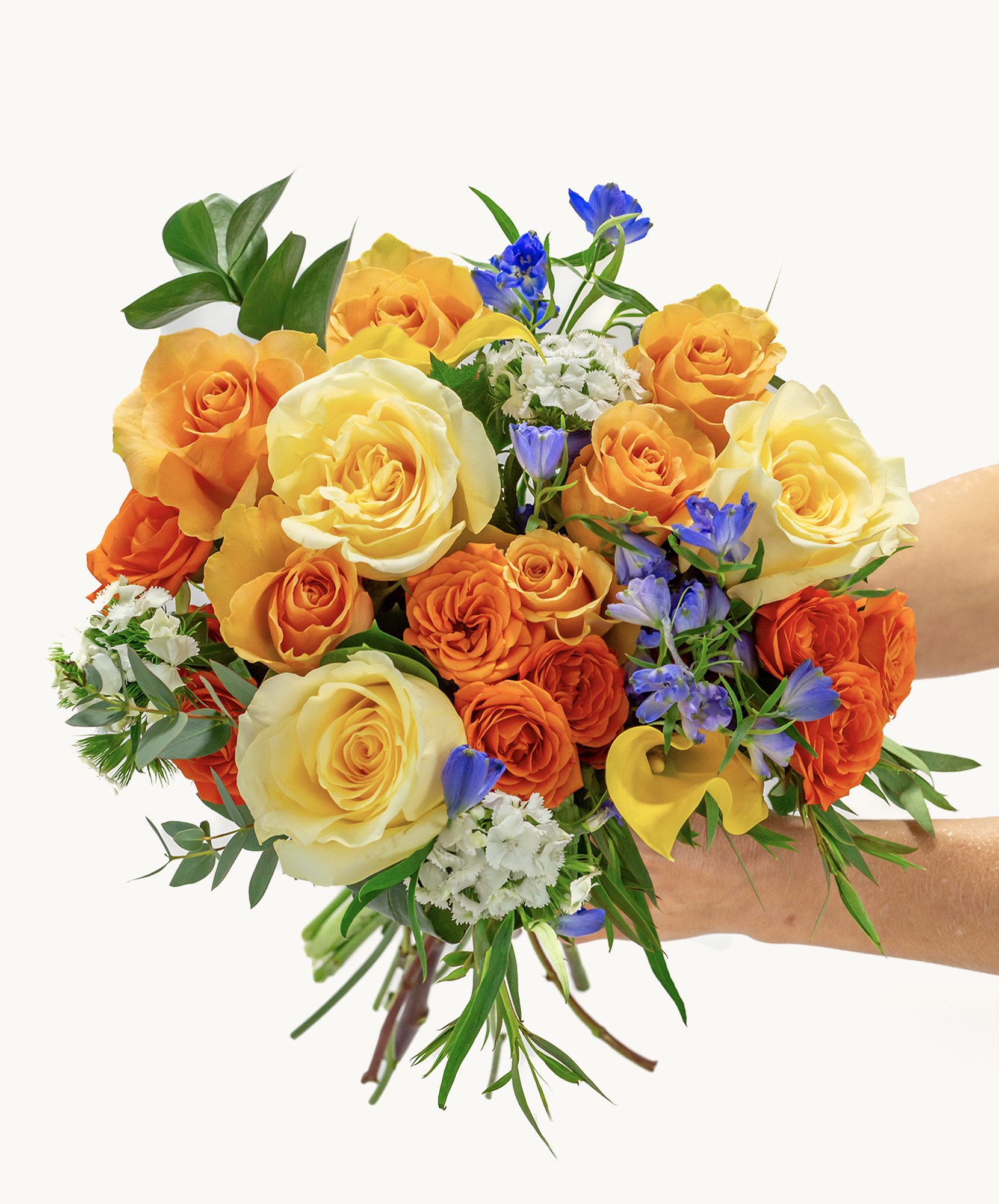 Vibrant bouquet of orange and yellow roses, accented with blue flowers and greenery.