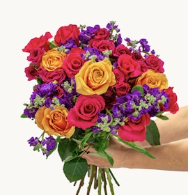Vibrant bouquet of roses in red, orange, and purple hues, perfect for celebrations.