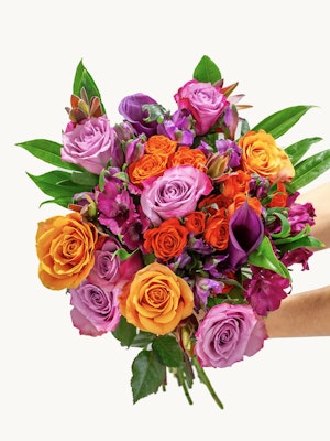 Vibrant bouquet featuring orange, pink, and purple roses, perfect for celebrations.