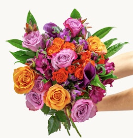 Vibrant bouquet featuring orange, pink, and purple roses, perfect for celebrations.