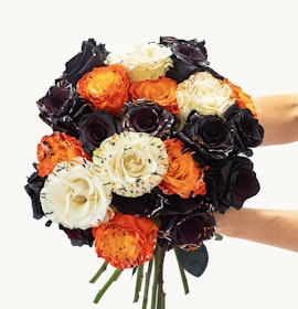 Vibrant bouquet featuring black, orange, and white roses, perfect for celebrations.