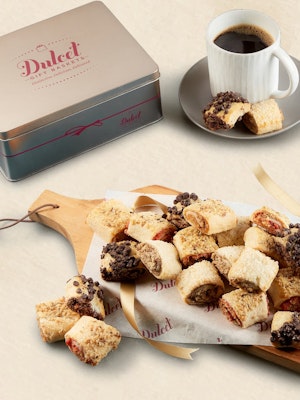 Decadent assortment of Dulcet pastries on a wooden board with coffee. Perfect treat!