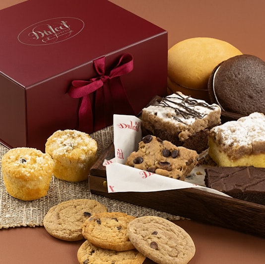 Delicious assortment of cookies and brownies presented in an elegant gift box.