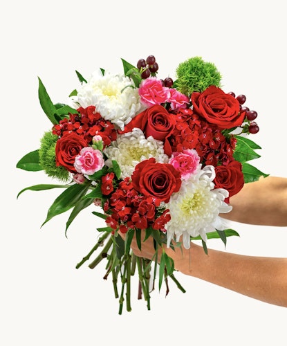 Vibrant bouquet featuring red roses, pink blooms, and white chrysanthemums, elegantly arranged.