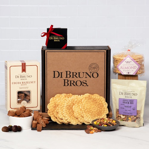 Gourmet gift box featuring cookies, snacks, and sweet treats from Di Bruno Bros.