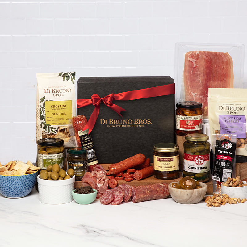 Gourmet gift box featuring a selection of artisanal cheeses, meats, and snacks.