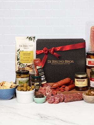 Gourmet gift box featuring a selection of artisanal cheeses, meats, and snacks.