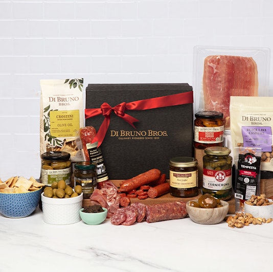 Gourmet gift box featuring a selection of artisanal cheeses, meats, and snacks.