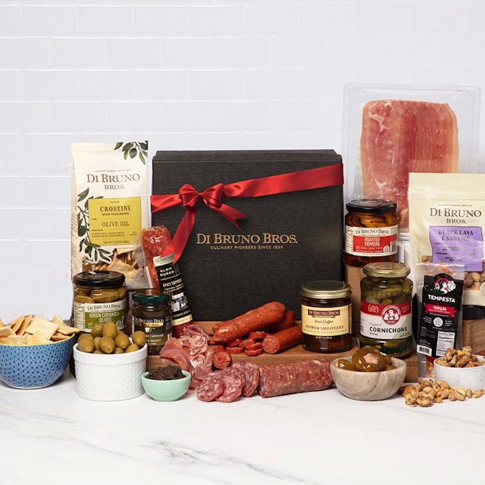 Gourmet gift box featuring a selection of artisanal cheeses, meats, and snacks.