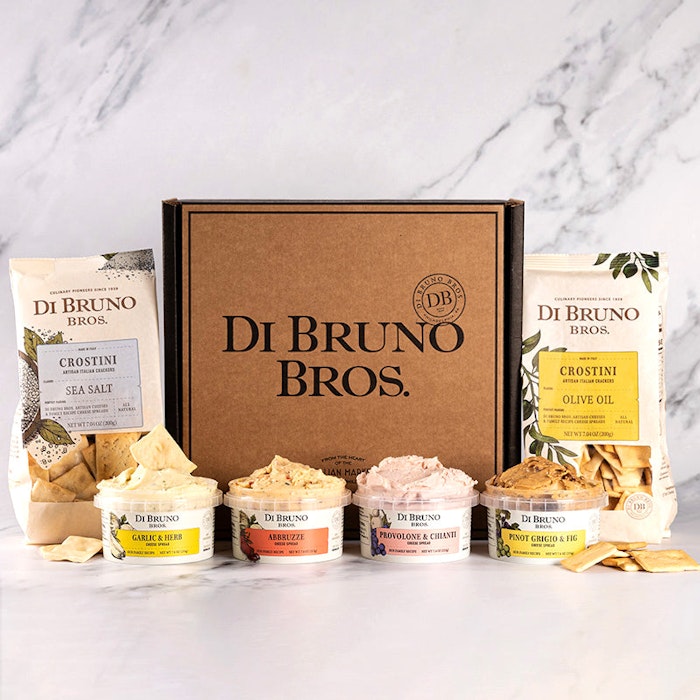 Gourmet cheese spread gift box featuring crostini and various artisanal cheeses.