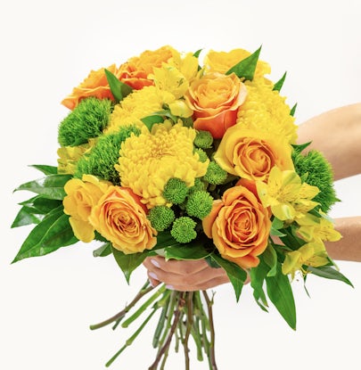 Vibrant bouquet featuring yellow roses, green accents, and cheerful chrysanthemums.