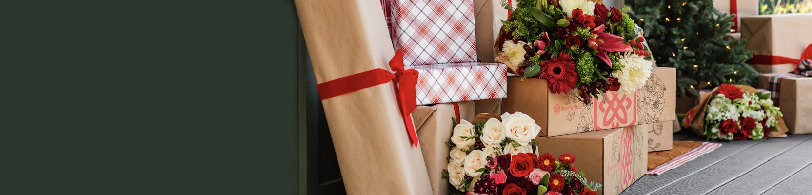 Beautifully wrapped gifts surrounded by festive floral arrangements, perfect for celebrations.